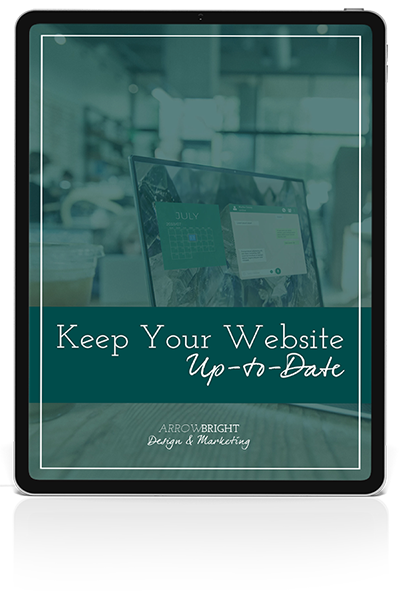Image of tablet with Keep Your Website Up to Date text on top of computer image